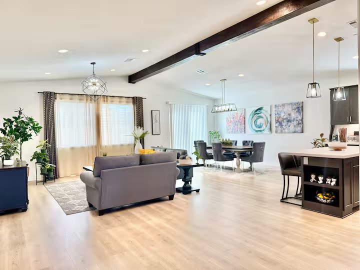Shared living and dining spaces with the kitchen beyond