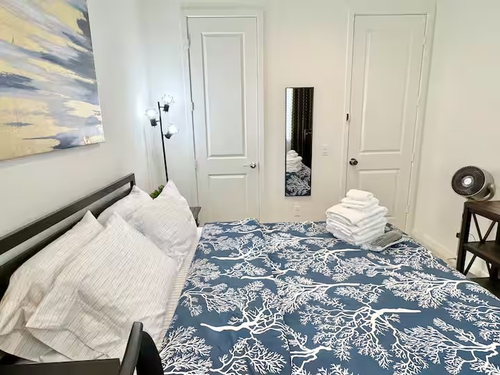 Another view of Diamond's bed, closet, and mirror
